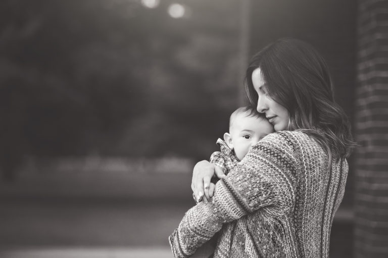 black and white photo of mother and baby