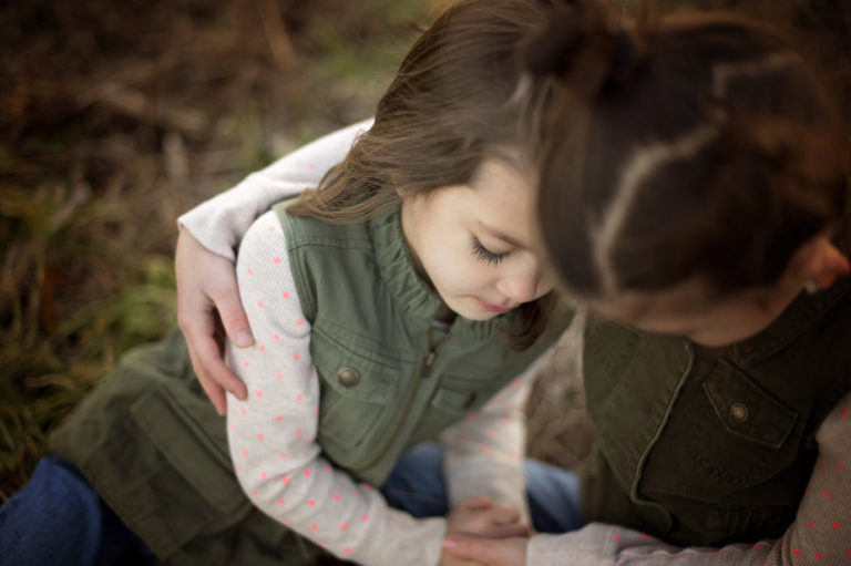 little girls holding eachother