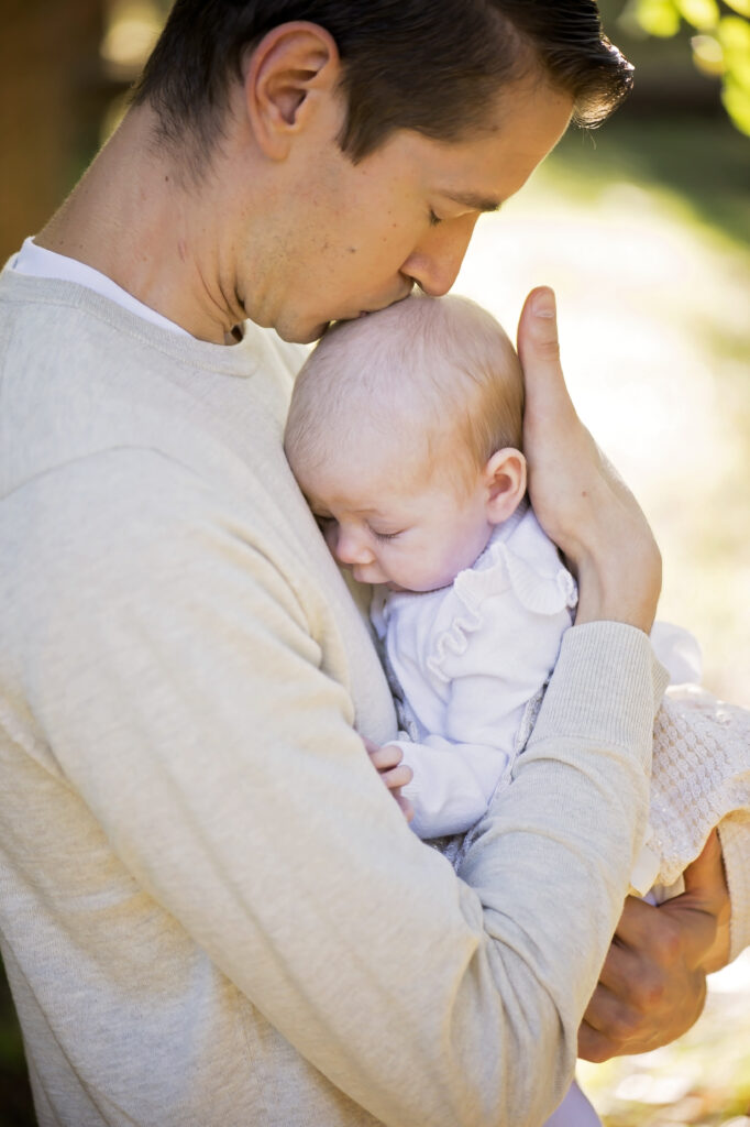 father with newborn in Saratoga Springs family photo shoot