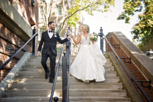 groom holding brides hand