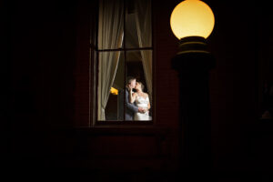 couple in window wedding photography